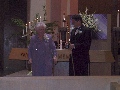 Carolyn and Steve light a candle